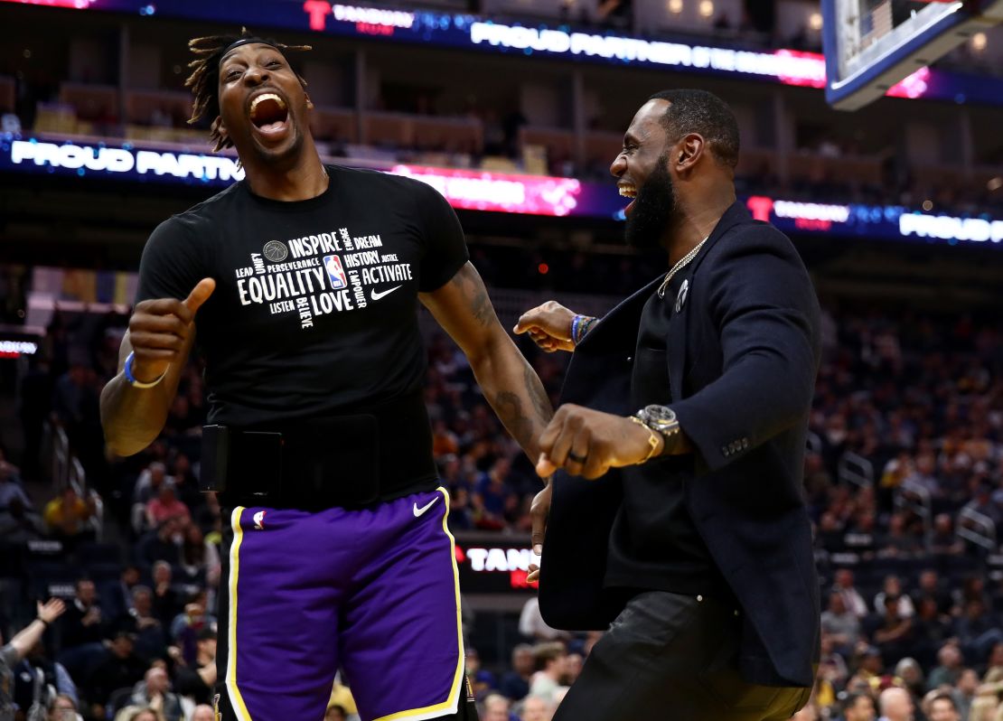 Howard and LeBron James react after teammate Kyle Kuzma dunked the ball during the game against the Golden State Warriors.
