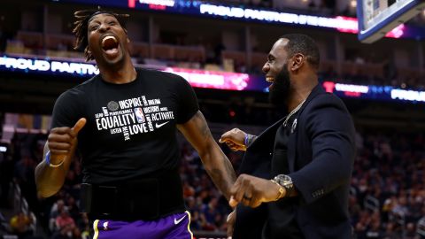 Howard and LeBron James react after teammate Kyle Kuzma dunked the ball during the game against the Golden State Warriors.