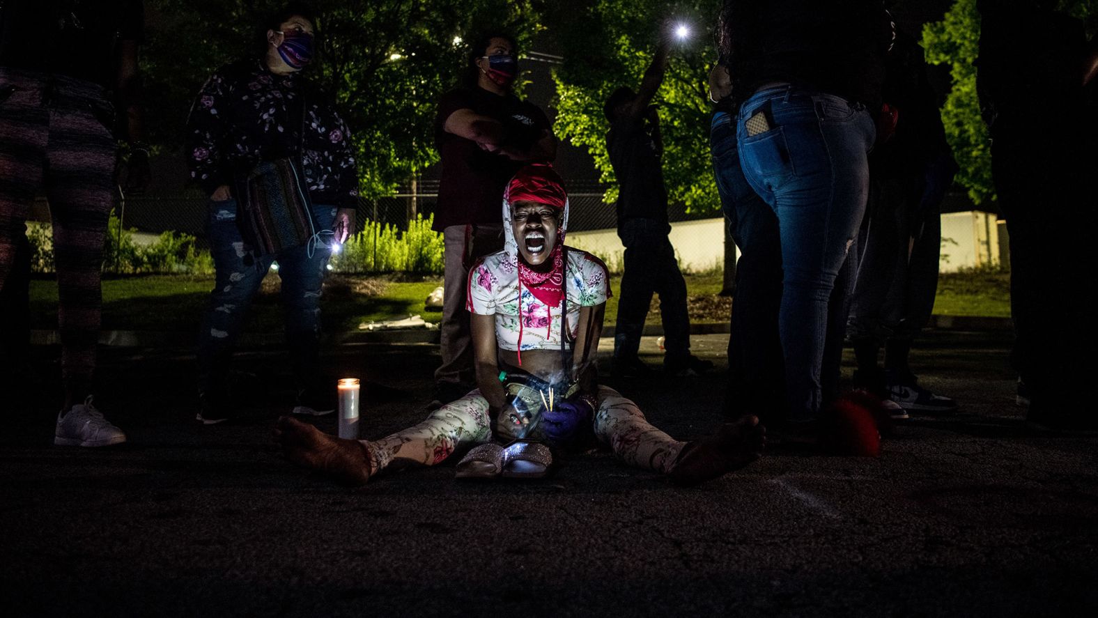 A woman shouts slogans as she protests outside a burned Wendy's restaurant in Atlanta on June 15. Demonstrators set fire to the restaurant on June 13 after Rayshard Brooks <a href="index.php?page=&url=https%3A%2F%2Fwww.cnn.com%2F2020%2F06%2F14%2Fus%2Fatlanta-protests-rayshard-brooks-sunday%2Findex.html" target="_blank">was fatally shot near the restaurant's drive-thru</a> on June 12. Brooks, 27, was shot after police moved to handcuff him for suspected driving under the influence, according to videos from the scene. The videos show that Brooks took an officer's Taser during the attempted arrest and then fired the Taser at the officers as he ran away. One officer then fatally shot Brooks three times with his service weapon, authorities said. Brooks was shot twice in the back, according to a release by the Fulton County Medical Examiner's Office.