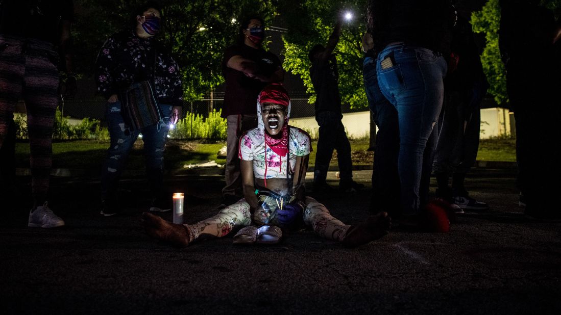 A woman shouts slogans as she protests outside a burned Wendy's restaurant in Atlanta on June 15. Demonstrators set fire to the restaurant on June 13 after Rayshard Brooks <a href="https://www.cnn.com/2020/06/14/us/atlanta-protests-rayshard-brooks-sunday/index.html" target="_blank">was fatally shot near the restaurant's drive-thru</a> on June 12. Brooks, 27, was shot after police moved to handcuff him for suspected driving under the influence, according to videos from the scene. The videos show that Brooks took an officer's Taser during the attempted arrest and then fired the Taser at the officers as he ran away. One officer then fatally shot Brooks three times with his service weapon, authorities said. Brooks was shot twice in the back, according to a release by the Fulton County Medical Examiner's Office.