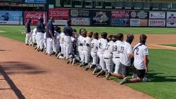 Des Moines Roosevelt High School baseball team kneeled during its season opener.