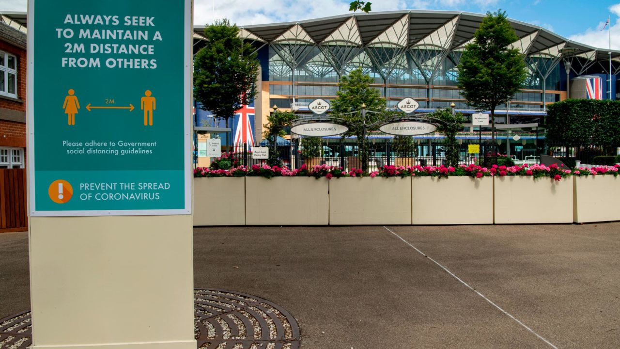 Social distancing signs are seen inside Ascot Racecourse this year.
