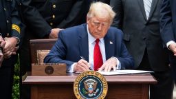 US President Donald Trump signs an Executive Order on Safe Policing for Safe Communities, in the Rose Garden of the White House in Washington, DC, June 16, 2020.