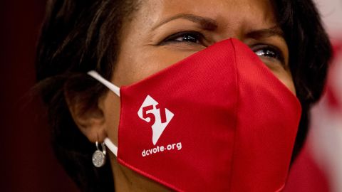 District of Columbia Mayor Muriel Bowser wears a mask with the number 51.