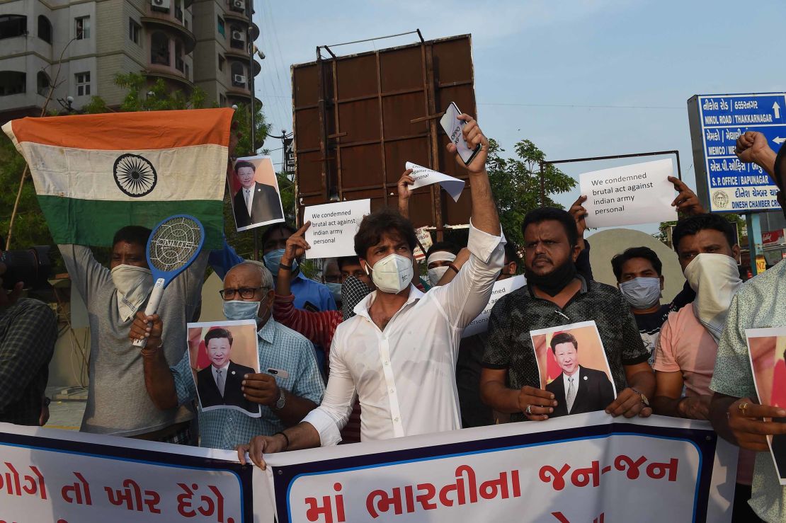 Demonstrators hold placards and shout slogans as they protest against the killing of three Indian soldiers by Chinese troops, in Ahmedabad, India on June 16, 2020.