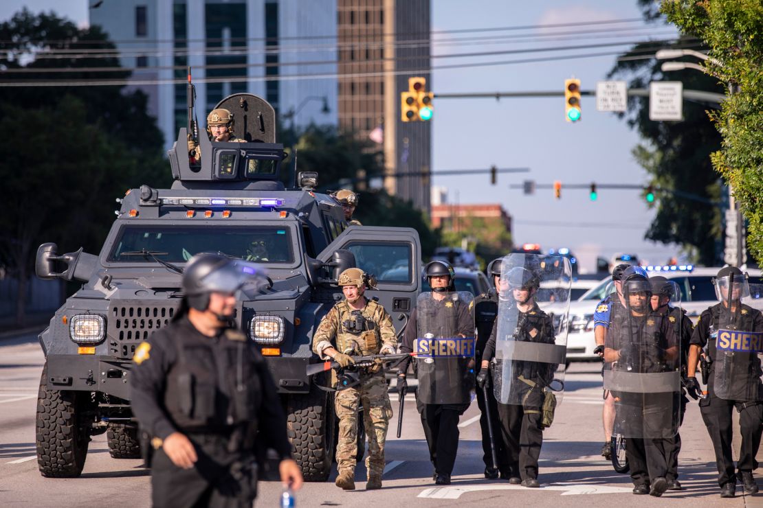 Columbia Police and the Richland County Sheriff's Department in South Carolina marched through the streets after enacting a curfew amid protests.