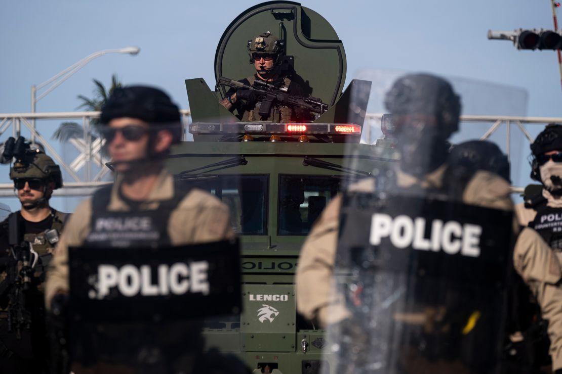 A Miami Police officer watches protestors from a armored vehicle during a rally in response to the recent death of George Floyd in Miami, Florida on May 31.