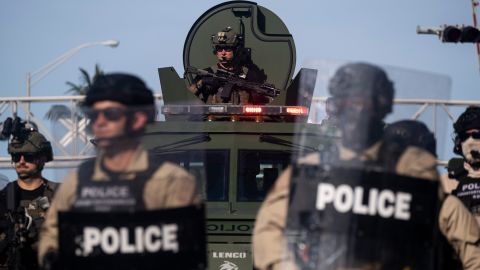 A Miami Police officer watches protestors from a armored vehicle during a rally in response to the recent death of George Floyd in Miami, Florida on May 31.