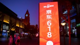 BEIJING, CHINA - JUNE 14: People walk by a JD.com advertisement of upcoming 618 Shopping Festival at Wangfujing Street on June 14, 2020 in Beijing, China. (Photo by VCG/Getty Images)