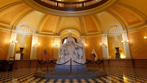In this March 18, 2020, file photo, a statue of Queen Isabella and Christopher Columbus stands in the rotunda of the Capitol in Sacramento, Calif. 