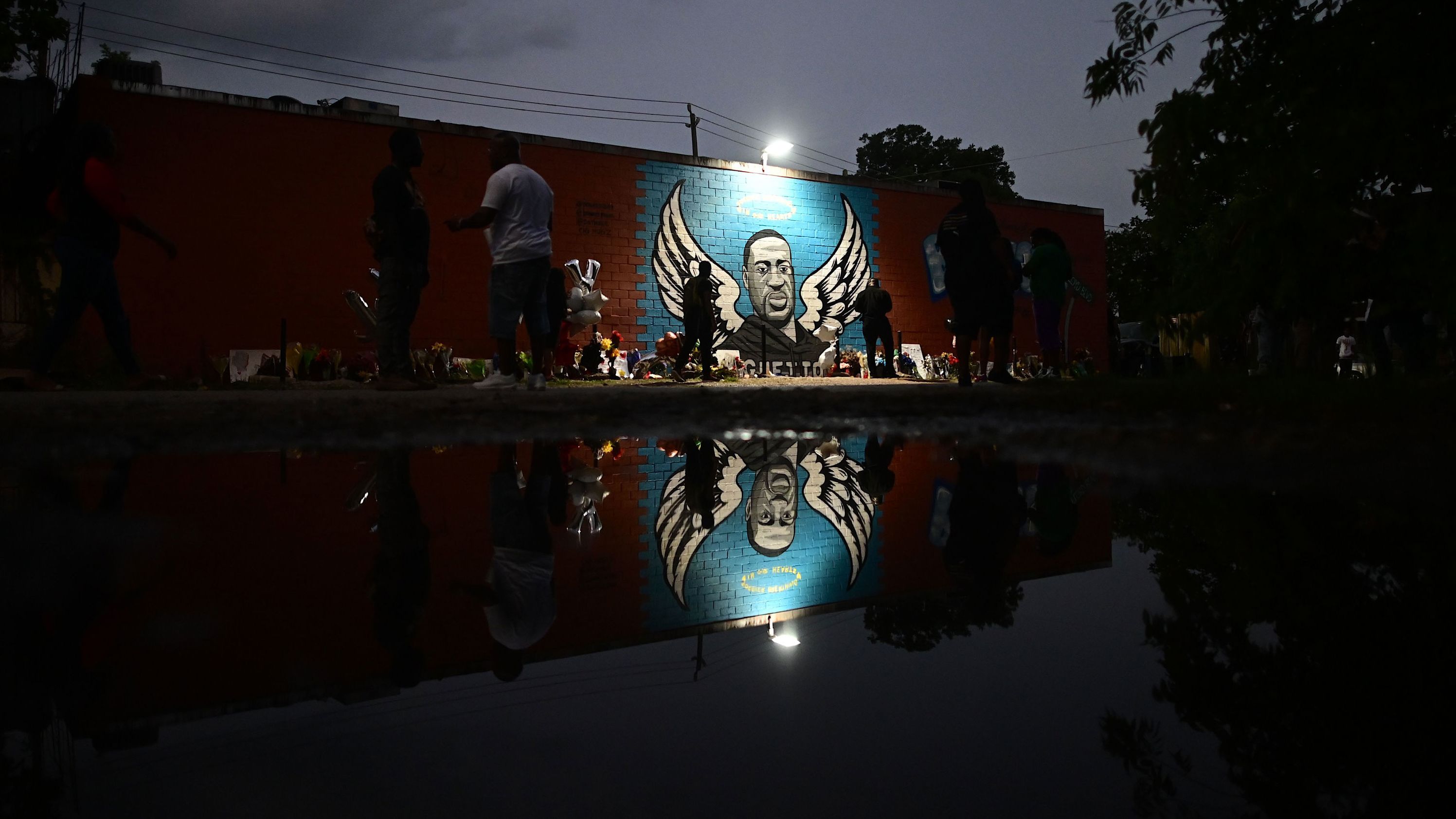 Floyd is depicted as an angel in his hometown of Houston. <a href="https://www.cnn.com/2020/06/03/us/george-floyd-mural-in-houston-trnd/index.html" target="_blank">The mural</a> was painted by the artist Donkeeboy on the side of Scott Food Mart.