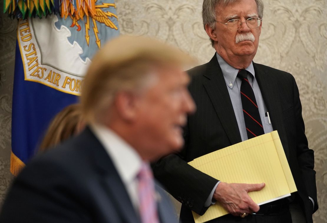 Then-national security adviser John Bolton listens to President Donald Trump during a meeting with Egyptian President Abdel-Fattah el-Sisi in April 2019.