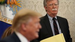 Then National Security Adviser John Bolton listens to U.S. President Donald Trump speak during a meeting with Egyptian President Abdel-Fattah el-Sisi in the Oval Office of the White House April 9, 2019 in Washington, DC. 