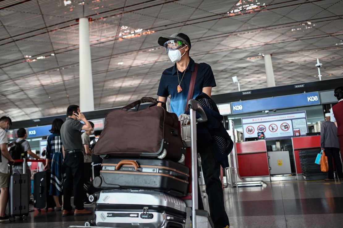 A man wearing a face mask and goggles at  Beijing Capital International Airport on June 17.