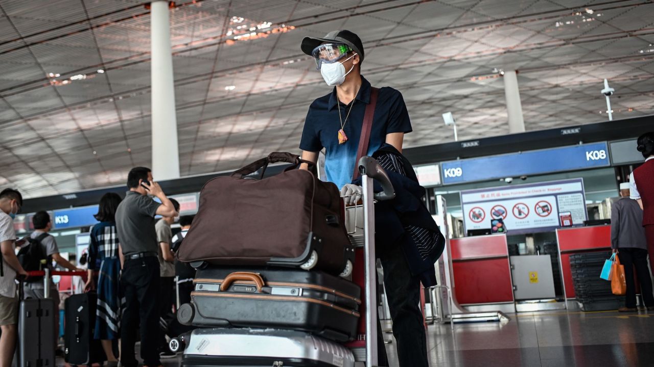 A man wearing a face mask and goggles at  Beijing Capital International Airport on June 17.