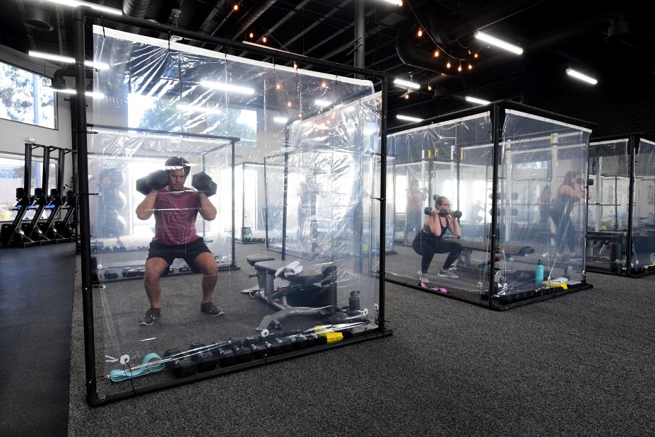 People exercise in workout pods at Inspire South Bay Fitness, a gym in Redondo Beach, California, on June 15.