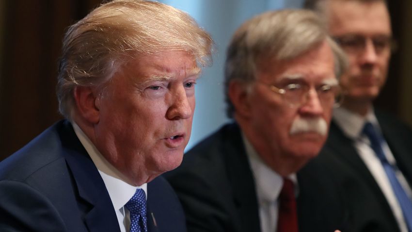 WASHINGTON, DC - APRIL 09:  U.S. President Donald Trump is flanked by National Security Advisor John Bolton as he speaks about the FBI raid at his lawyer Michael Cohen's office, while receiving a briefing from senior military leaders regarding Syria,  in the Cabinet Room, on April 9, 2018 in Washington, DC. The FBI raided the office of Michael Cohen on Monday as part of the ongoing investigation into the president's administration. (Photo by Mark Wilson/Getty Images)