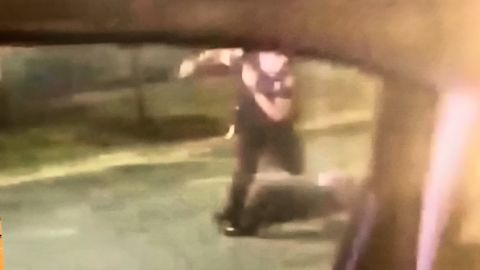 A still photo shows former officer Garrett Rolfe kick Rayshard Brooks after the shooting, according to Fulton County District Attorney Paul Howard.