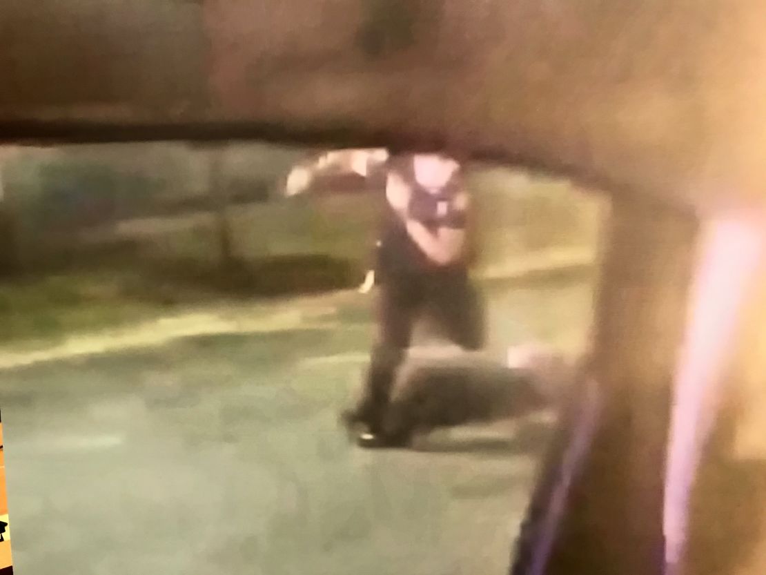 A still photo shows former officer Garrett Rolfe kick Rayshard Brooks after the shooting, according to Fulton County District Attorney Paul Howard.