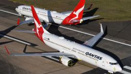 Qantas 737-800 aircraft parked on the east-west runway at Sydney Airport due to lack of parking on May 20, 2020 in Sydney, Australia.