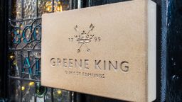 London, November 2017. A view of a Greene King sign on the Coach and Horses pub on Bruton Street, in Mayfair.