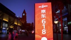 BEIJING, CHINA - JUNE 14: People walk by a JD.com advertisement of upcoming 618 Shopping Festival at Wangfujing Street on June 14, 2020 in Beijing, China. (Photo by VCG/VCG via Getty Images)