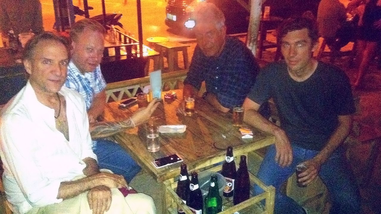 Joe Cummings, front left, dines with Pok Pok chef/owner Andy Ricker, Anthony Bourdain and author Austin Bush. 