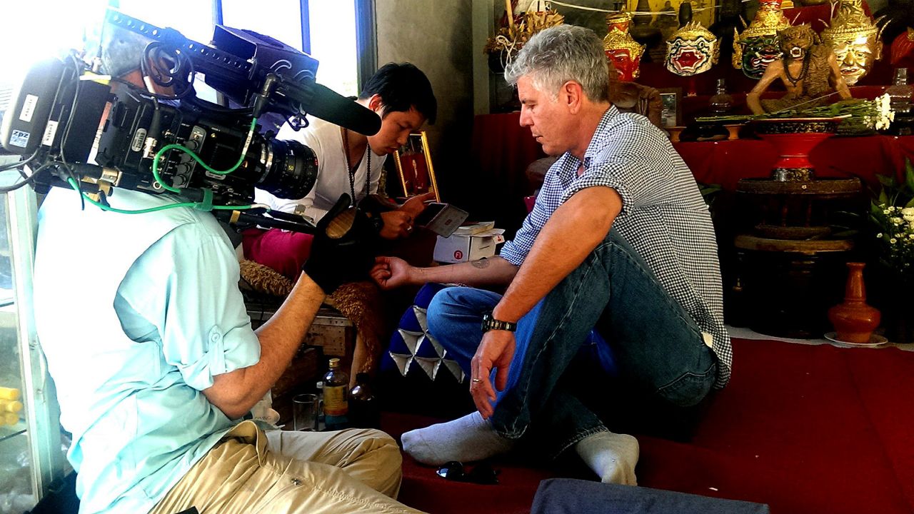 Joe Cummings took Bourdain to get a sacred sak yan tattoo.