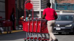 An employee pushes Target Corp. shopping carts outside a store in Emeryville, California, U.S., on Friday, Feb. 28, 2020. Target is expected to release earnings figures on March 3. Photographer: David Paul Morris/Bloomberg via Getty Images