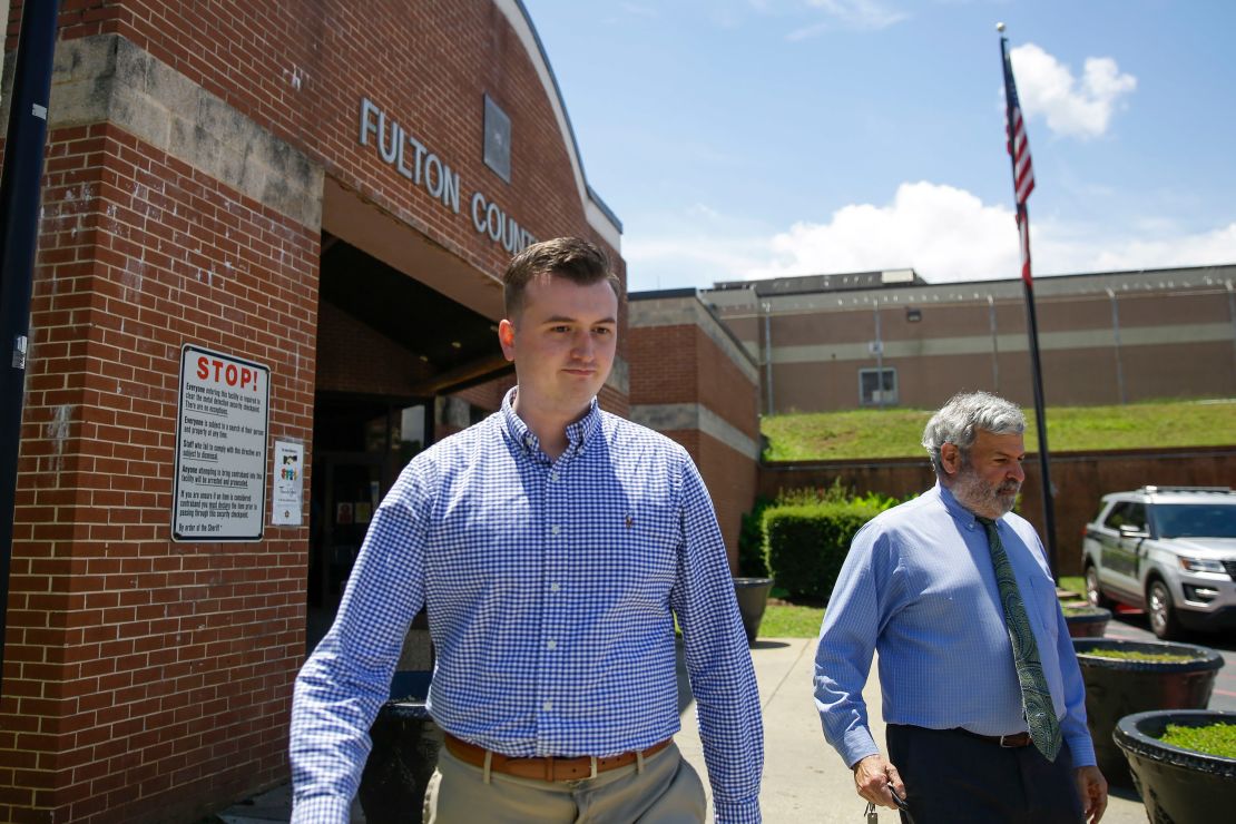 Former officer Devin Brosnan walks out of the Fulton County Jail on bail after his release Thursday. 