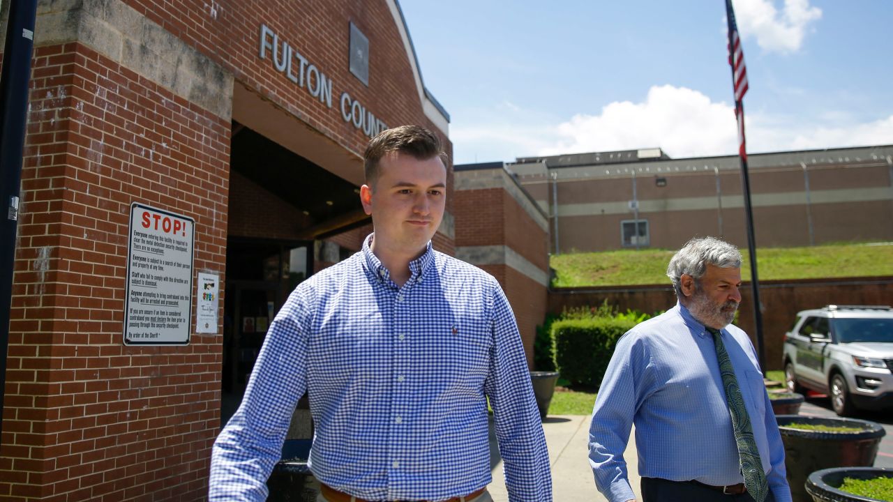 Former officer Devin Brosnan walks out of the Fulton County Jail on bail after his release Thursday.
