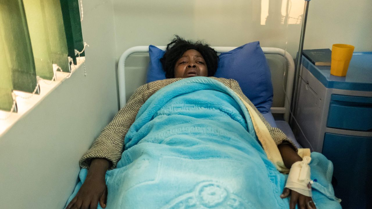 Cecilia Chimbiri lies on a hospital bed at a private hospital in Harare on May 15. She is one of the three youth leaders from the MDC Alliance who were admitted after allegedly being abducted and beaten up by police. 