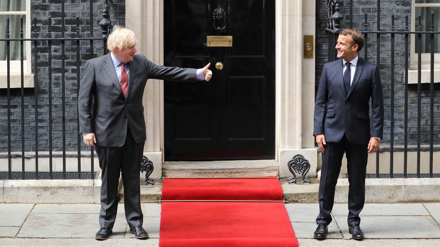 Boris Johnson greets Emmanuel Macron from a safe distance at 10 Downing Street in London on Thursday. 