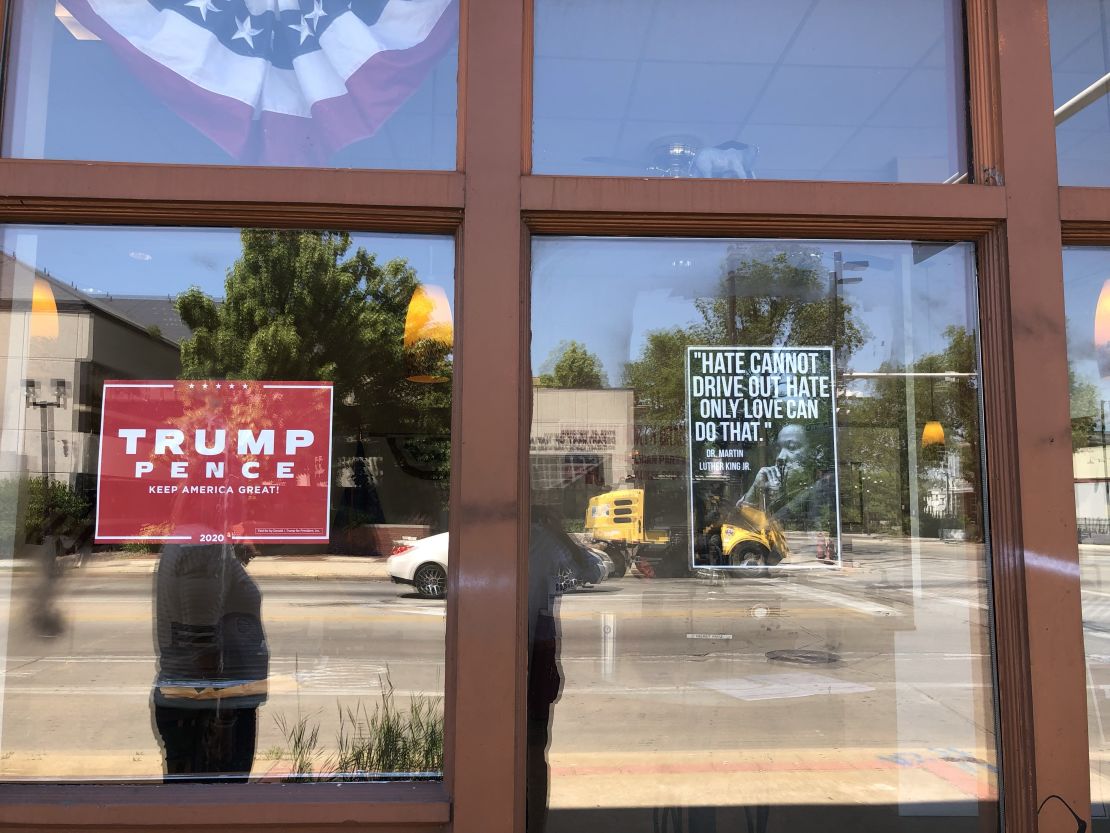 A quote from Martin Luther King Jr. is prominently displayed in the window, alongside a red Trump campaign sign, at the Wisconsin GOP field office at the corner of North Avenue and Martin Luther King Jr. Drive.