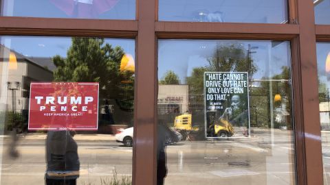A quote from Martin Luther King Jr. is prominently displayed in the window, alongside a red Trump campaign sign, at the Wisconsin GOP field office at the corner of North Avenue and Martin Luther King Jr. Drive.