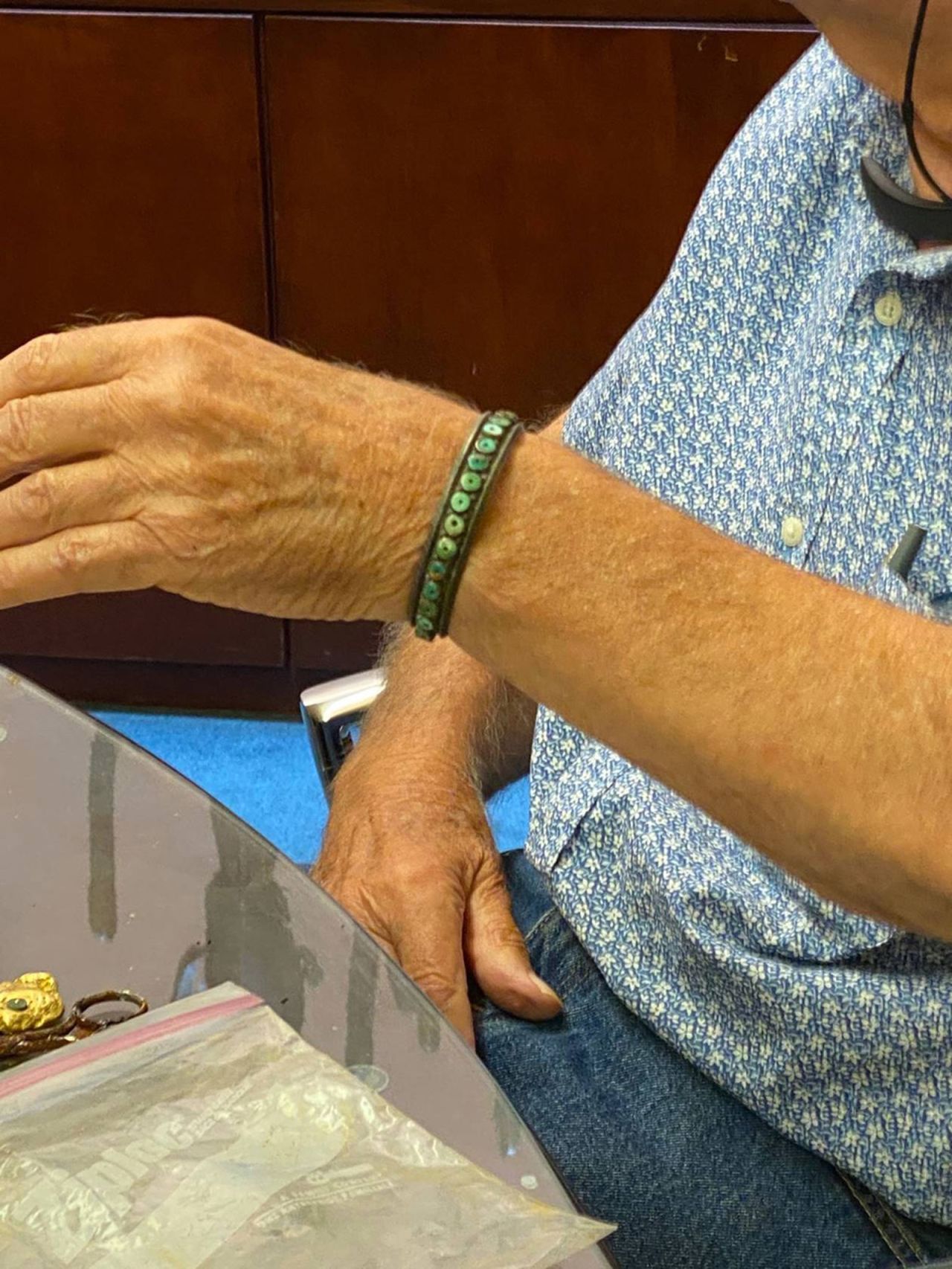 Fenn wearing a bracelet made of silver, which has been tarnished black. 
