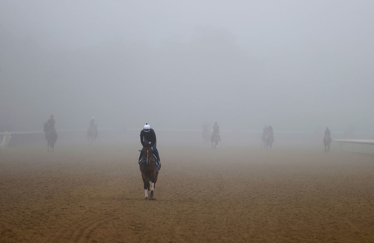 Racehorses train in a morning fog at Belmont Park in Elmont, New York, on Thursday, June 18. The Belmont Stakes will take place on Saturday <a href="https://www.cnn.com/2020/05/19/us/belmont-stakes-triple-crown-spt/index.html" target="_blank">without spectators.</a> And instead of being the last leg of the Triple Crown, it will be the first this time around.