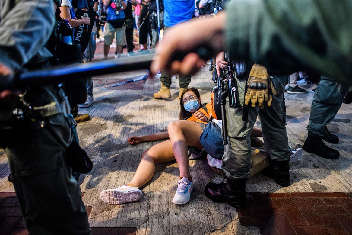 A pro-democracy protester is detained by police in Hong Kong on Friday, June 12. It has been a year since pro-democracy protesters <a href="https://www.cnn.com/2019/06/09/world/gallery/hong-kong-extradition-protest/index.html" target="_blank">took to the streets</a> to voice their opposition to a proposed extradition bill. 