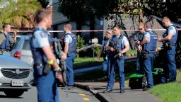 Armed police gather at the scene of a shooting incident following a routine traffic stop in Auckland, New Zealand, Friday, June 19, 2020.