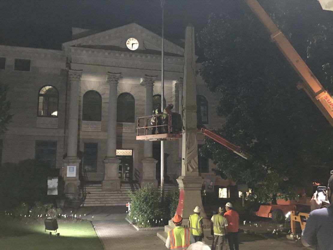A crane removes a Confederate monument from Decatur Square in Georgia on Thursday night.