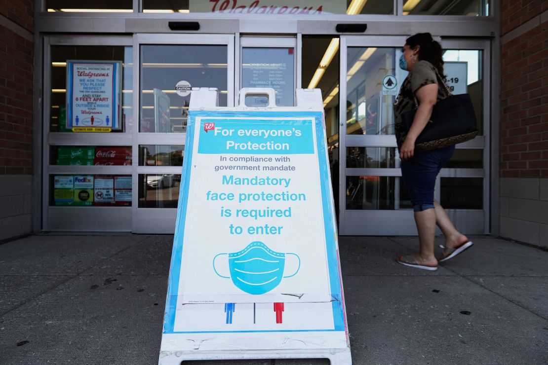 A sign about mandatory mask use at a Walgreens drugstore in Glenview, Ill., Thursday.