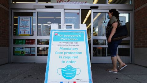 A sign about mandatory mask use at a Walgreens drugstore in Glenview, Ill., Thursday.