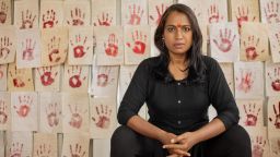 Kalki Subramaniam pictured in front of Red Wall testimonials.