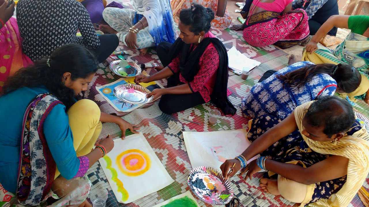 Participants create works during a Transhearts workshop.