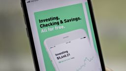The Robinhood application is displayed in the App Store on an Apple Inc. iPhone in an arranged photograph taken in Washington, D.C., U.S., on Friday, Dec. 14, 2018. The Securities Investor Protection Corp. said a new checking account from Robinhood Financial LLC raises red flags and that the deposited funds may not be eligible for protection. Photographer: Andrew Harrer/Bloomberg via Getty Images