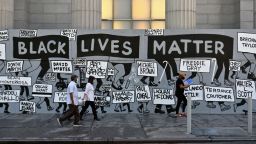People walk past a "Black Lives Matter" mural at Union Square on June 12, 2020 in New York City.