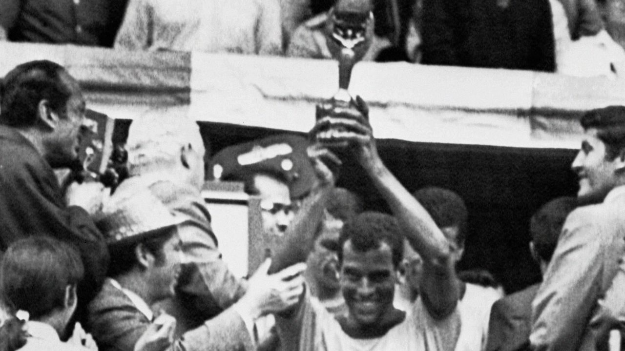 Captain Carlos Alberto holds aloft the Jules Rimet Cup after Brazil defeated Italy 4-1 in the 1970 World Cup final.