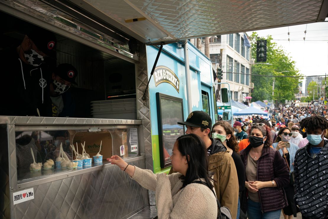 People line up for samples of Ben & Jerry's ice cream during ongoing Black Lives Matter events in the so-called Capitol Hill Organized Protest" area on June 14, 2020 in Seattle.