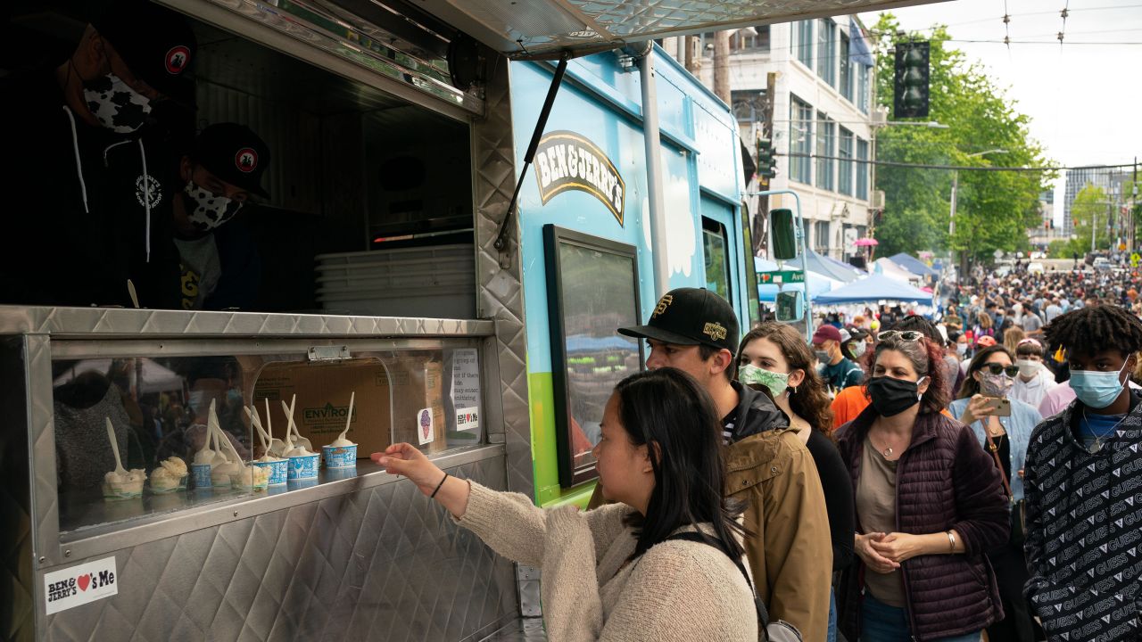People line up for samples of Ben & Jerry's ice cream during ongoing Black Lives Matter events in the so-called Capitol Hill Organized Protest" area on June 14, 2020 in Seattle.
