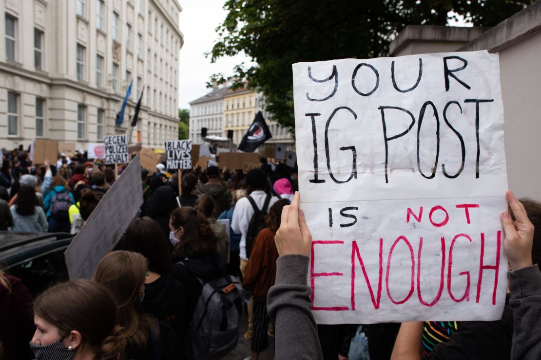 A protester holds up a sign during a Black Lives Matter protest in front of the US Embassy in Vienna, Austria on June 5, 2020.